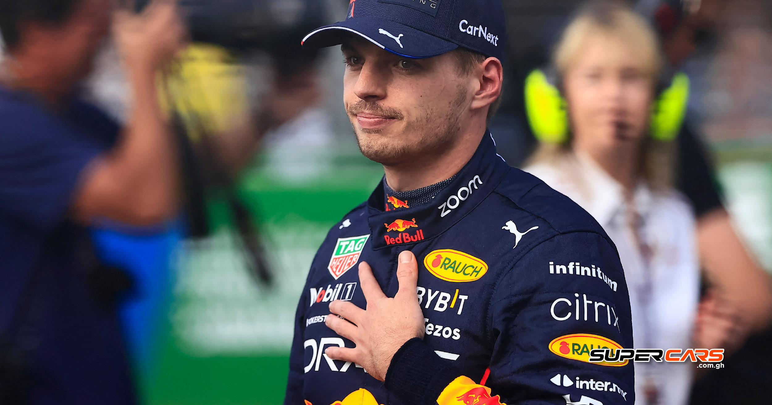 Max Verstappen in action on the track, with a determined expression as he races towards his goal of winning his fourth World Championship title in the 2024 Formula 1 season