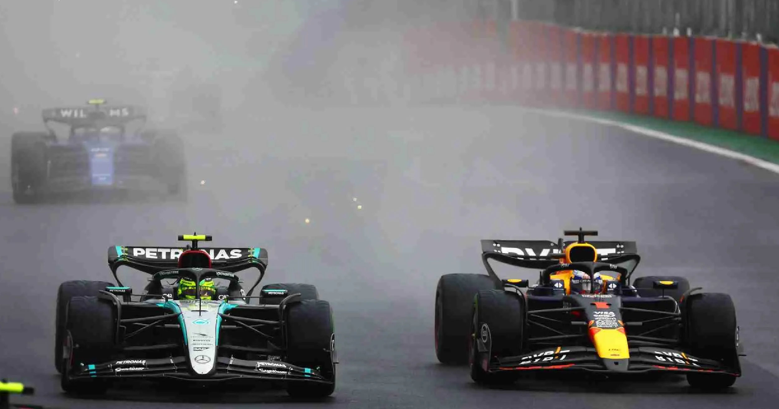 Mercedes and Red Bull F1 cars racing side-by-side in challenging wet conditions at the Brazilian Grand Prix, with heavy spray limiting visibility